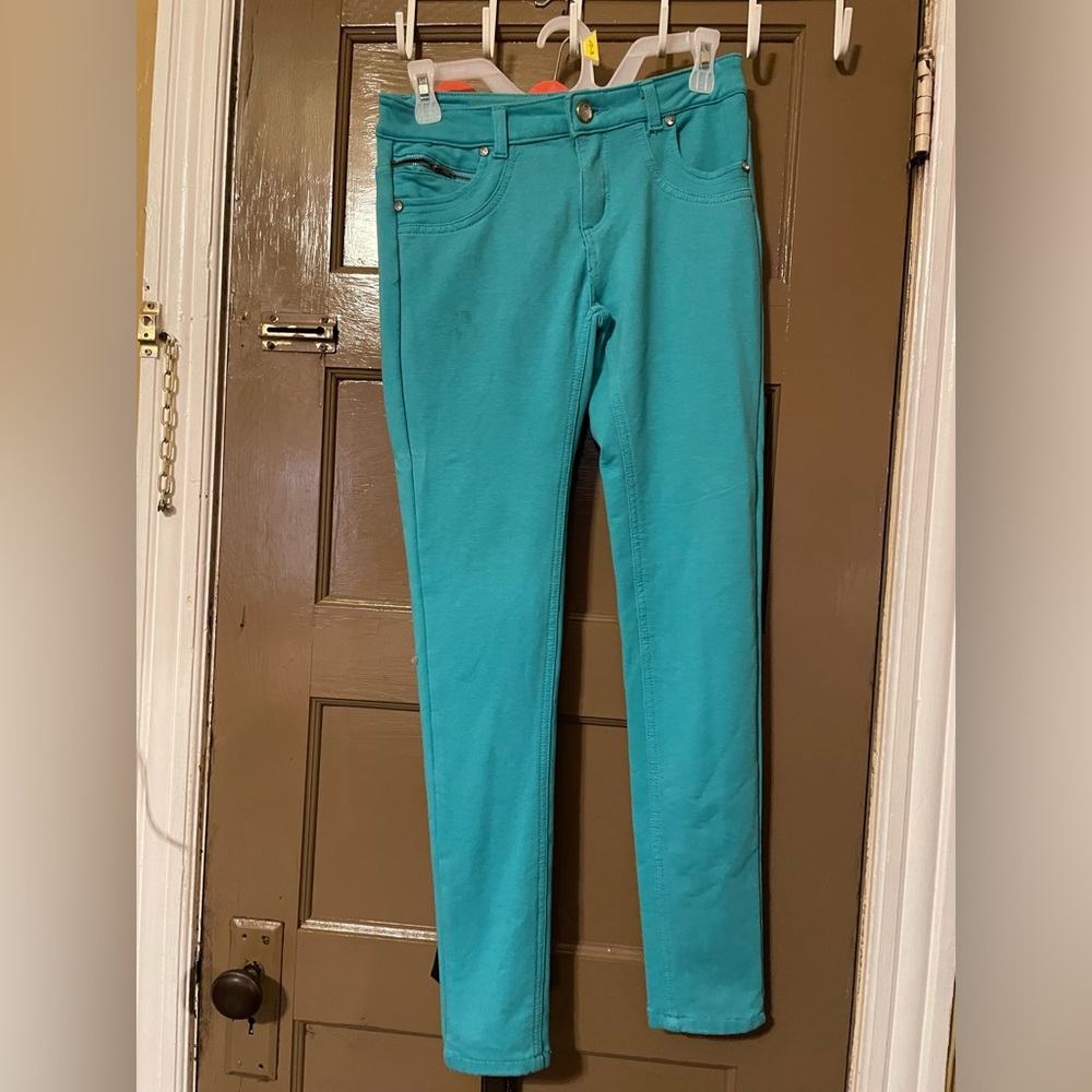 Turquoise long pants used a small stain